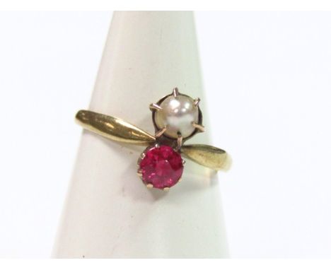 A ladies dress ring, claw set with pearl and pink stone, a plain shank marked 333, size K, in an associated box.