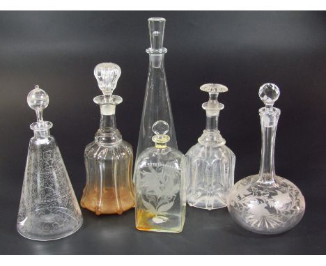 A 20thC Baccarat etched glass decanter, with orb finial and tapering body, heavily decorated with a repeat scroll and geometr