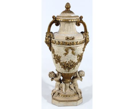 A neo-Classical design plaster urn, with gilt highlights and a circular lid with pineapple finial and a beaded outline, above
