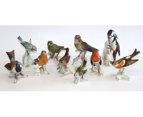 A collection of Goebel bird figures, to include chaffinch, a great spotted woodpecker, blue tit, wren, brambling, firecrest, 