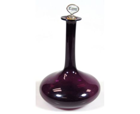 A 19thC amethyst coloured glass ship's decanter, with white metal mother-of-pearl and cork Rum stopper, with cylindrical stem