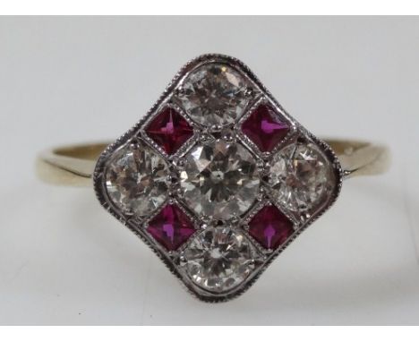 An Art Deco ruby and diamond dress ring, set with five diamonds, central stone approx 0.19cts, flanked by four smaller stones