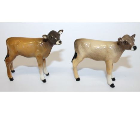 A Beswick Newton Tinkle calf, with tan and dark brown body, cream front feet, dark brown head and black tail, 7cm high, and a