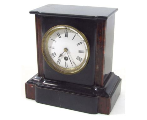 A late 19thC black slate and marble mantel clock, with 10cm dia. dial revealing a key wind movement in inverted case, 22cm hi