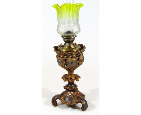 A late 19thC cast metal and glass oil lamp, with clear glass Griffin Brand funnel, etched yellow clear and floral glass shade