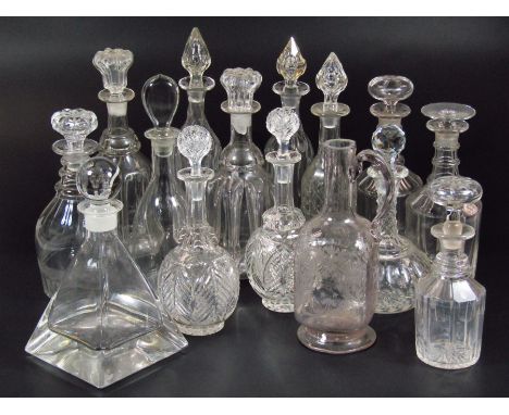 A glass decanter, with plain orb stopper and tapering triangular shaped body, unmarked, 29cm high, a pair of 19thC decanters 