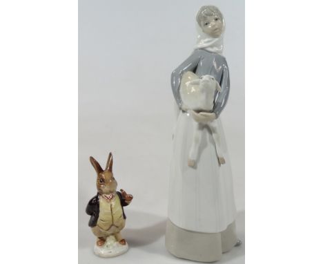 A 20thC Lladro figure, of a lady in standing pose holding lamb, printed marks beneath, 30cm high, and a Beswick Beatrix Potte