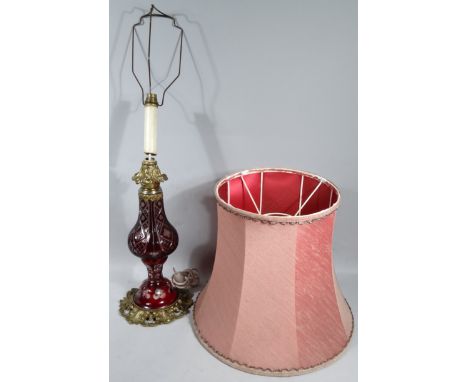 An early 20thC Bohemian style flash glass table lamp, in red and white floral hobnail cut decoration with metal mounts and mo