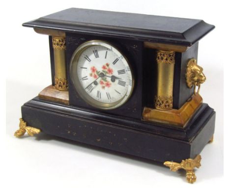 A late 19thC mantel clock, black and gilt decoration, centred by a 13cm dia. Roman numeric dial with eight day movement, flan