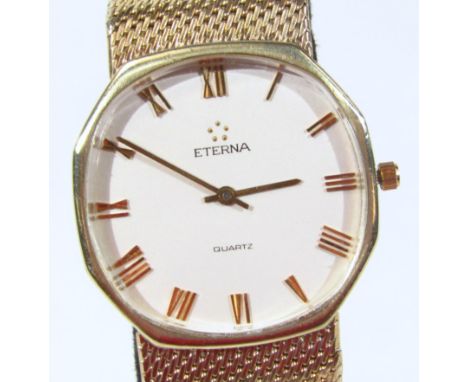 A gentleman's Eterna wristwatch, with 9ct gold case and strap, the 3cm wide octagonal face with Roman numerals and baton poin