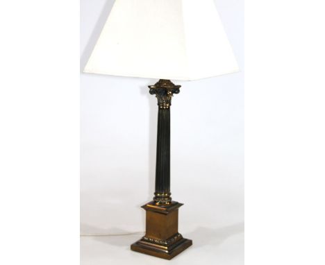 A 19thC style brass Corinthian column table lamp, with tapering stem, stepped base and cream shade, with a modern electrical 