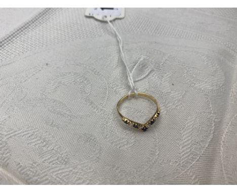 An 18ct gold sapphire and cz ring, size N