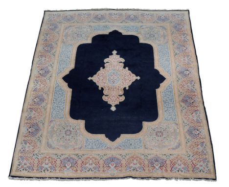 A Kirman carpet , approximately 373cm x 273cm  A Kirman carpet  , approximately 373cm x 273cm 