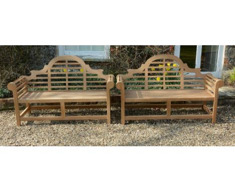 A pair of teak garden seats in the manner of Lutyens, of recent manufacture  A pair of teak garden seats in the manner of Lut