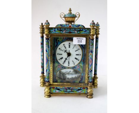 A CLOISONNE ENAMEL DECORATION BRASS TABLE TIMEPIECE with urn finial and later electric movement, 29cm high 