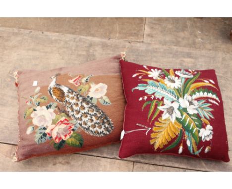 TWO EARLY 20TH CENTURY TAPESTRY AND BEADWORK CUSHIONS one depicting a peacock amongst flowers, the other depicting a bunch of