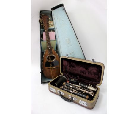 A CONSOLE STEELEBONITE CASED STUDENTS CLARINET and a mother of pearl and ebony inlaid mandolin in fitted case (2)