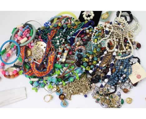 A LARGE SELECTION OF ASSORTED COSTUME JEWELLERY to include bracelets, necklaces, bangles, earring, enamel brooches etc