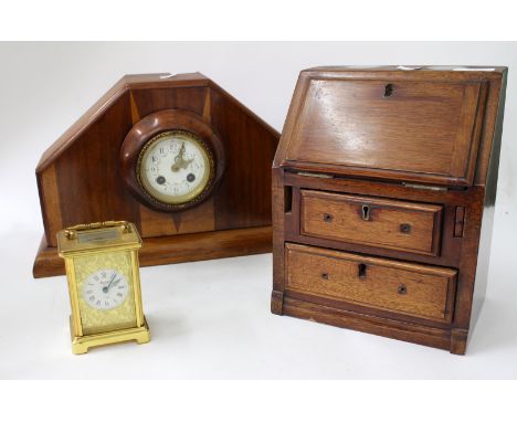 AN ART DECO STYLE MAHOGANY CASED MANTLE CLOCK the enamel dial with Arabic numerals and painted decoration, overall 41cm wide 