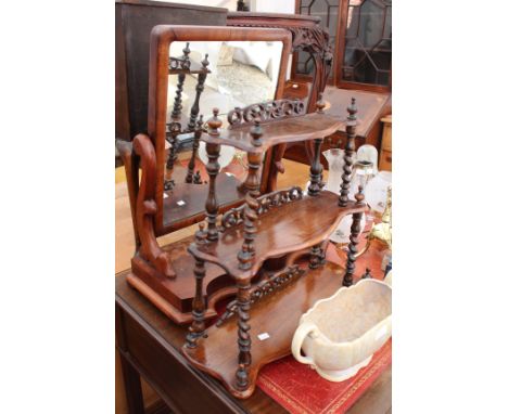 A VICTORIAN MAHOGANY SERPENTINE FRONTED SWING TOILET MIRROR58cm wide together with a three tier shelf with barley twist suppo