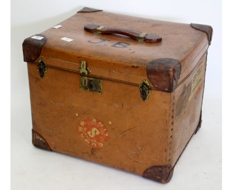A 20TH CENTURY LEATHER BOUND TRUNK with initials painted to the top with a Cunard line cruise label to one side, 51cm x 40cm 