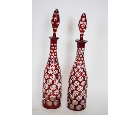 Pair of decanters with tear drop stoppers in Bohemian style with ruby overlay