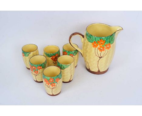 A Myott lemonade set comprising a jug and 6 beakers with an Art Deco floral design (7)jug 21 cm highGood original condition
