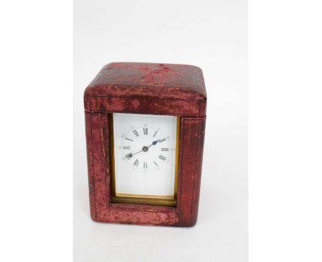 Late 19th century French brass carriage clock with white enamel dial and Roman numerals, in original case