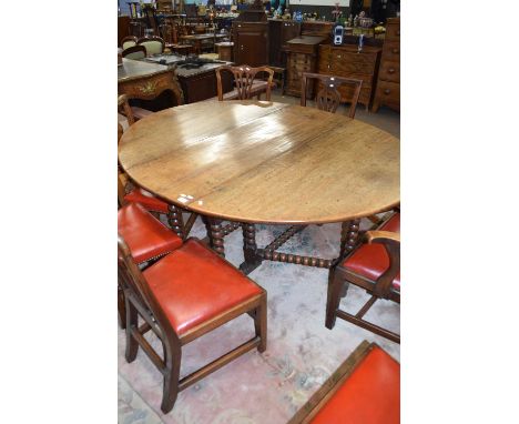 18th century oak drop leaf dining table on bobbin turned legs, 169cm wide when open