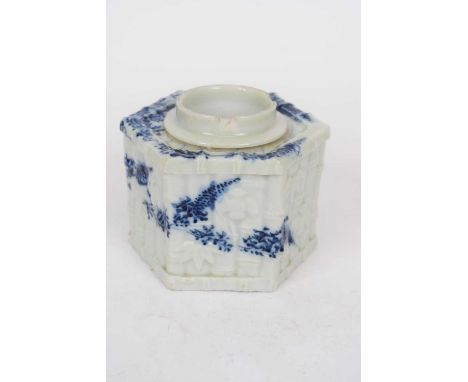 An 18/19th century Japanese porcelain inkwell of facetted form moulded with bamboo and birds with blue and white painted flor