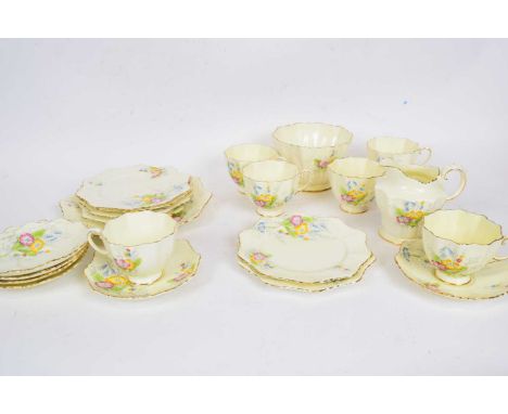 A part tea set by Paragon with a floral pattern and Art Deco shape comprising; 6c/s, 6 side plates and sandwich plate, milk j