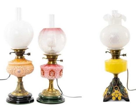 THREE OIL LAMPS including ATTRACTIVE YELLOW & CAST METAL OIL LAMP with opaque glass shade and funnel, base with floral decora
