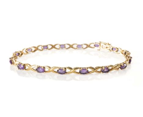9CT GOLD AMETHYST BRACELET, mounted with 16 oval cut stones on X-link chain, 19cms, 4.8gProvenance: deceased estate Vale of G