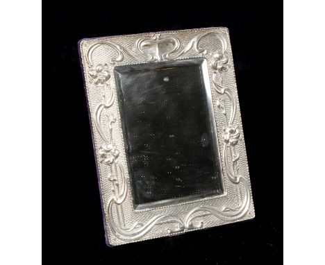 EDWARD VII SILVER ART NOUVEAU TOILET MIRROR, Chester 1902, embossed foliate and basket weave frame around bevelled mirror pla