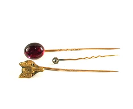 A group of three stick pins including on set with fox head