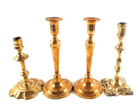 A Georgian seamed Brass candlestick, one other Georgian stick plus a pair of 19th Century Brass sticks