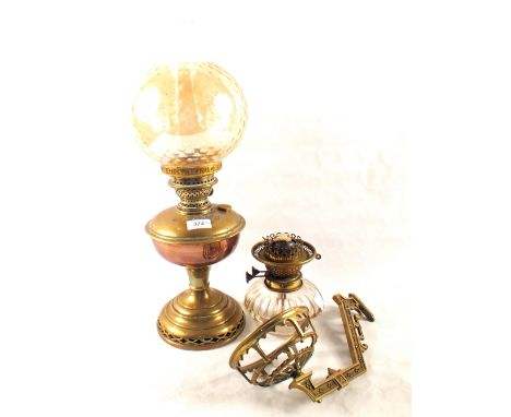 A Brass wall oil lamp and one other
