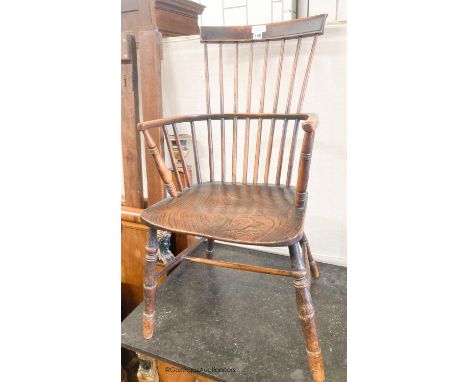   A 19th century elm and fruitwood Windsor comb back armchair, width 50cm, depth 40cm, height 96cm