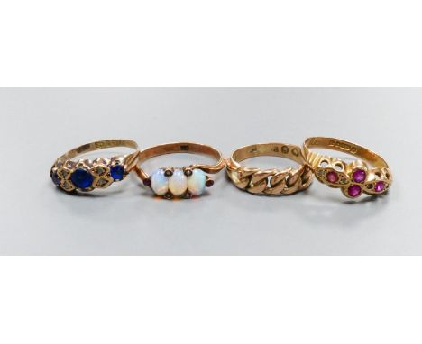   Four early 20th century 9ct gold and gem set rings including three stone opal with seed pearl spacers, gross weight 8.4 gra