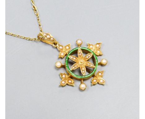   A yellow metal, enamel and split pearl set circular pendant with foliate border, overall 36mm, on a 9ct fine link chain, 40