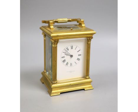   An early 20th century French brass Corinthian pattern repeating carriage clock, 19cm high handle up