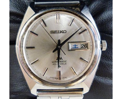   A gentleman's 1980's stainless steel Seiko Lord Matic day date wrist watch, on associated strap, model 5606 7000, cased dia