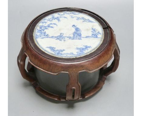   A 19th century Chinese blue and white circular tile inset hongmu stand, 22cm