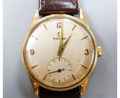   A gentleman's 1950's 9ct gold Omega manual wind wrist watch, movement c.266, on associated strap, cased diameter 33mm, gros