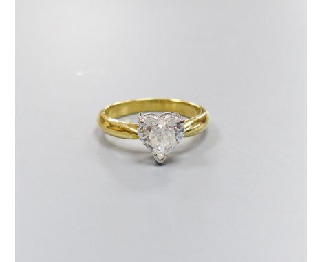   A modern 18ct gold and solitaire heart shaped diamond ring, size K, gross weight 3.6 grams,the stone weighing approx. 0.80c