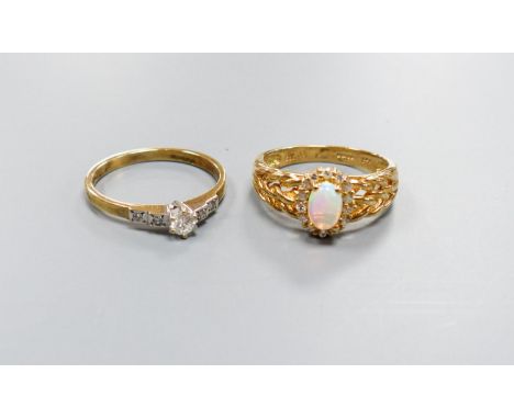   A modern 9ct gold, white opal and diamond set oval cluster ring, size M and a similar single stone diamond ring with diamon