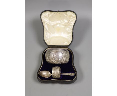   A Victorian cased matched embossed silver christening trio, comprising , bowl, napkin ring and fork, bowl, Sheffield, 1889,