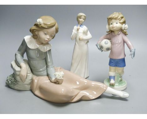   A Lladro figure of a girl holding a football, a large Nao figure and one similar Spanish figure.