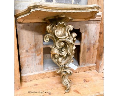   An Italian carved pine gilt console table, width 66cm, depth 38cm, height 67cm