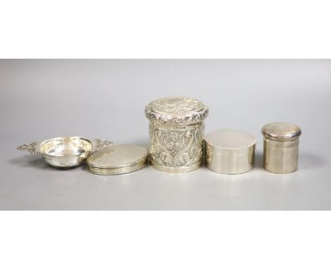   A Georgian silver snuff box of oval form, together with a small tea strainer and three other silver boxes, 10.5oz.